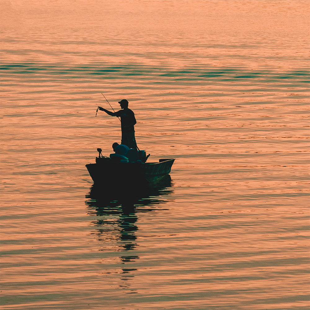 Man Fishing on the Lake